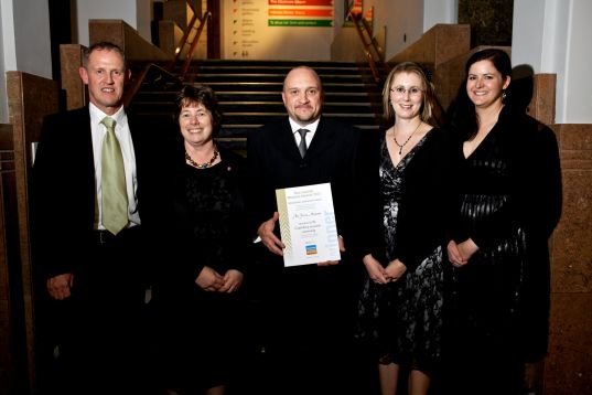 Thérèse and members of her team, including, at left, then Deputy Chief of Air Force Air Commodore Kevin Short (now Air Marshal, Chief of Defence Force), after receiving a special award from Museums Aotearoa for support provided to colleagues in the heritage sector after the 2010/2011 earthquakes. National Museum Awards, 2012. Image: Museums Aotearoa.