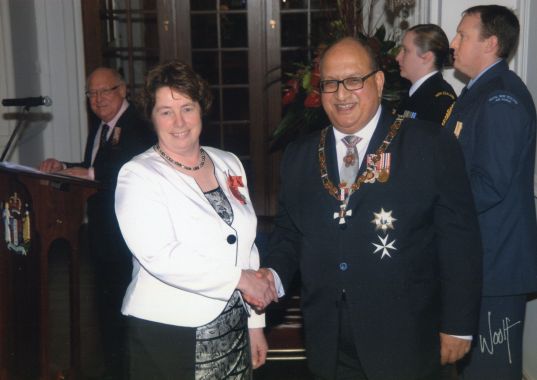 Thérèse having been made a Member of the New Zealand Order of Merit by then Governor-General, Sir Anand Satyanand, 2011. Image: Government House Official.