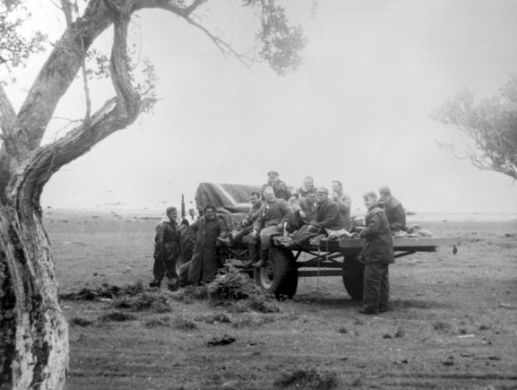 Salvage of Maritime Operational Conversion Unit Sunderland, NZ4111, after it was holed and sank in Te Whanga Lagoon, Chatham Islands.
Members of the salvage party on a tractor's trailler.