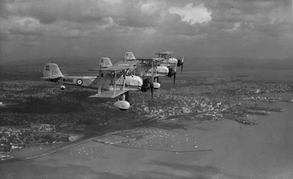 Image from the Alwyn Palmer personal collection.Air to air view of three Vildebeests in formation over Auckland city. From front: NZ103, NZ102, NZ111.