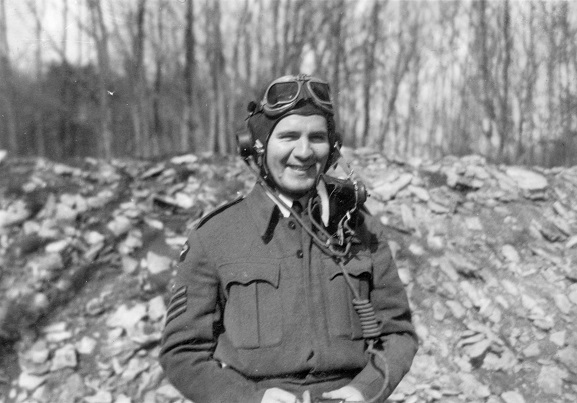 New Zealand pilot, Flight Sergeant Ronald Russell wearing flying helmet at RAF Station Southrop, April 1944. Image ref ALB933374003, Air Force Museum of New Zealand.