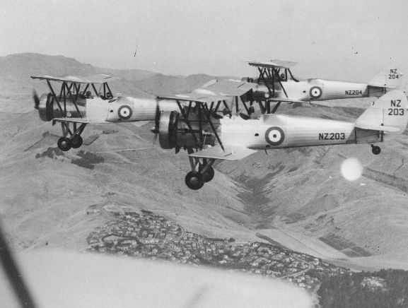 Air to air view of three Avro 626s in formation over the Port Hills, near Christchurch.
Near aircraft; NZ203. Far aircraft NZ204. 
Original negative number WgF184.