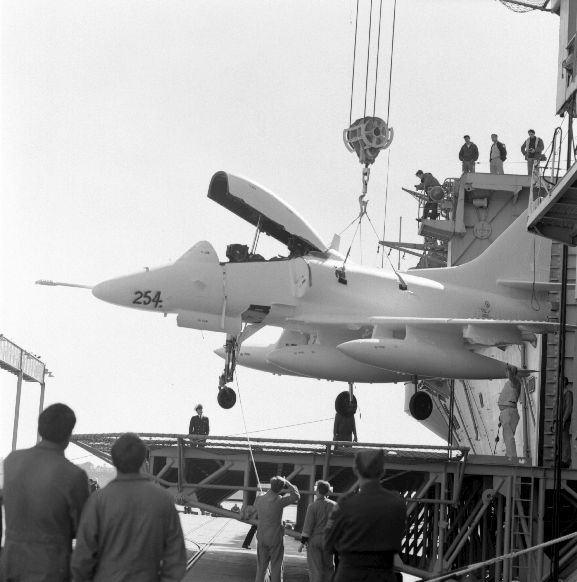 The delivery of the new Skyhawks. A TA-4K labelled 254 (NZ6254?), being lowered from the aircraft carrier U.S.S. Okinawa. Auckland.