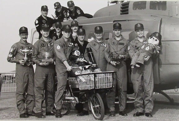 The No. 3 Squadron RNZAF Helimeet 90 team with their trophies. 'Crazy Kiwi' can be seen in the centre, still wearing his RNZAF uniform. Also of note is Henry Fanshaw, the teddy bear mascot of No. 75 Squadron RNZAF, who had clearly been taken along for the ride! Fanshaw is now on display here at the Air Force Museum of New Zealand. Image from the No. 3 Squadron Unit History.