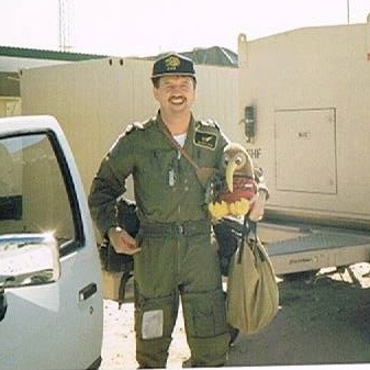 Member of 230 Squadron RAF, Howard Jones, with Crazy Kiwi at their main operating base at Ras al Gar in Saudi Arabia in 1990. Image courtesy of Howard Jones, via Facebook.