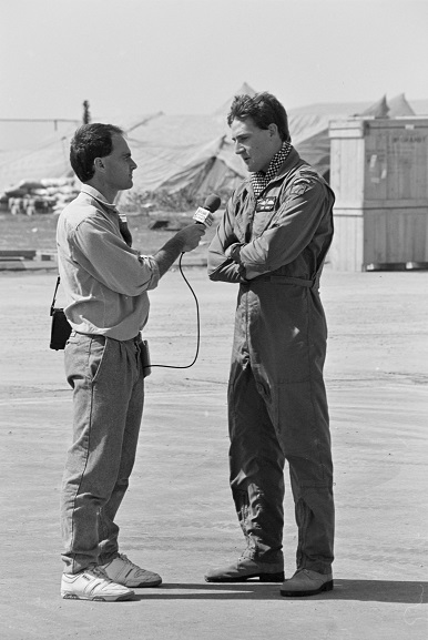 No. 40 Squadron pilot, Flight Lieutenant DG Wake, being interviewed by a Radio News reporter at Al Qaisumah Airport, Saudi Arabia. Feb-Mar 1991. Image ref PD19-22-91, RNZAF Official.