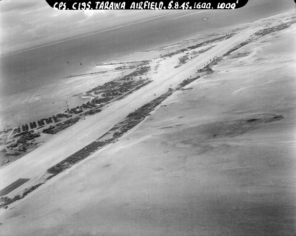 Aerial oblique view of the United States Hawkins Field airstrip on Betio, Tarawa Atoll. Gilbert Islands, 5 August 1945. Image ref CPSTin7frame5, RNZAF Official.