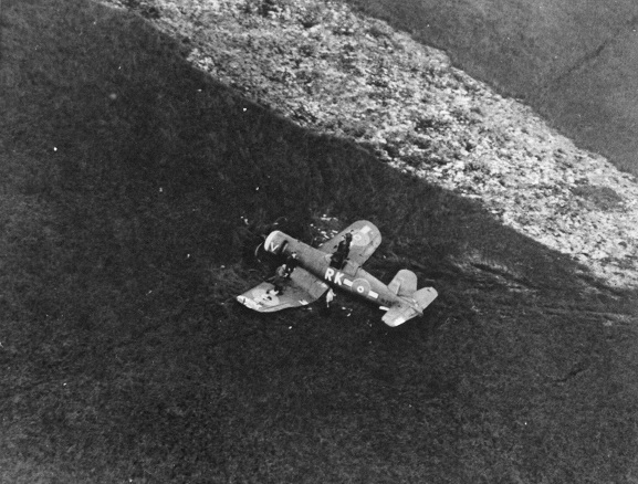 Aerial oblique view of Corsair NZ5320, from No. 3 Servicing Unit, after crash landing in Piako Swamp, 27 October 1944. Image ref HIST489, RNZAF Official.