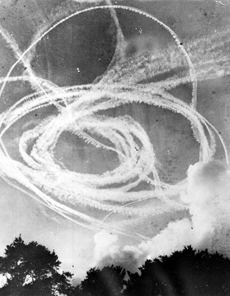 Vapour trails in the sky from a dog fight, believed to be over England. Believed to be during the Battle of Britain, 1940. Image ref MUS06006, Air Force Museum of New Zealand.