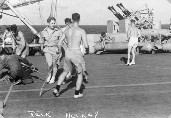 Image from the W Ford personal album collection. 
Members of No. 14 Squadron RNZAF playing 'Deck hockey' on the flight deck of HMS 'Glory'. March 1946. Image ref ALB922911020, Air Force Museum of New Zealand.