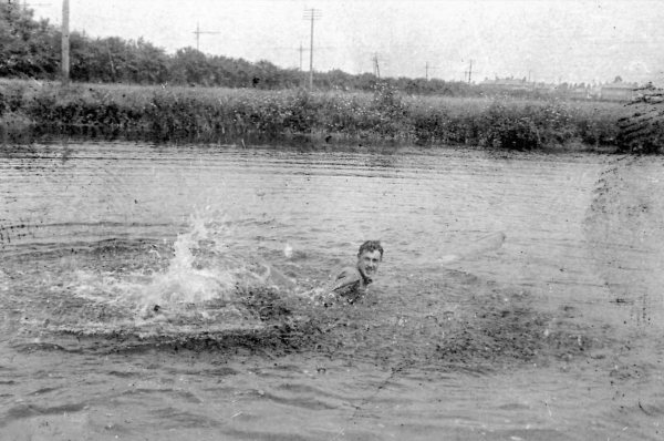 Man-swimming-in-lake