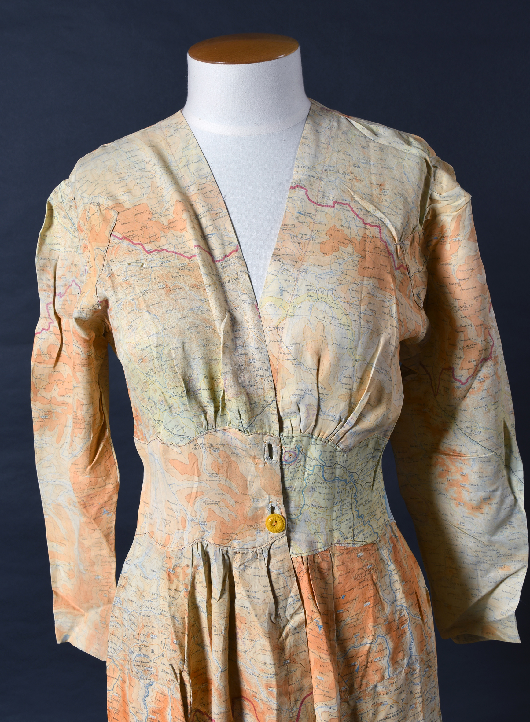 Fashion escape: A dress made from carefully sewn together silk escape and evasion maps.