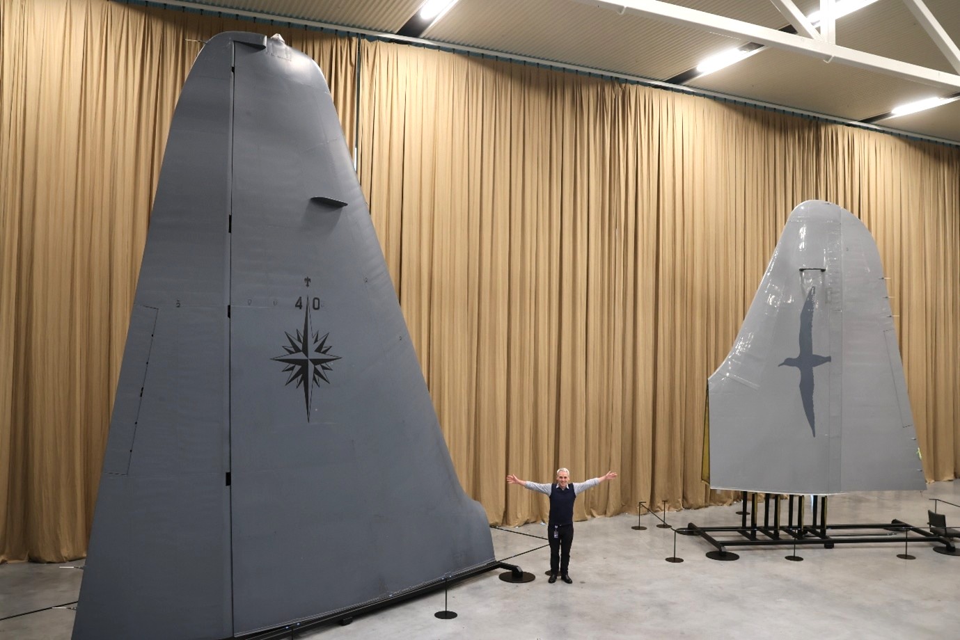 Museum Director Brett Marshall with the tails.